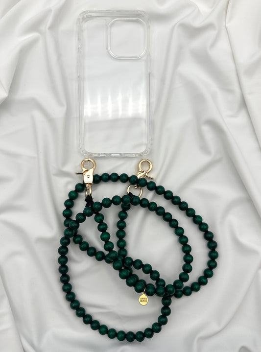 Clear phone case with green beaded lanyard on white fabric background
